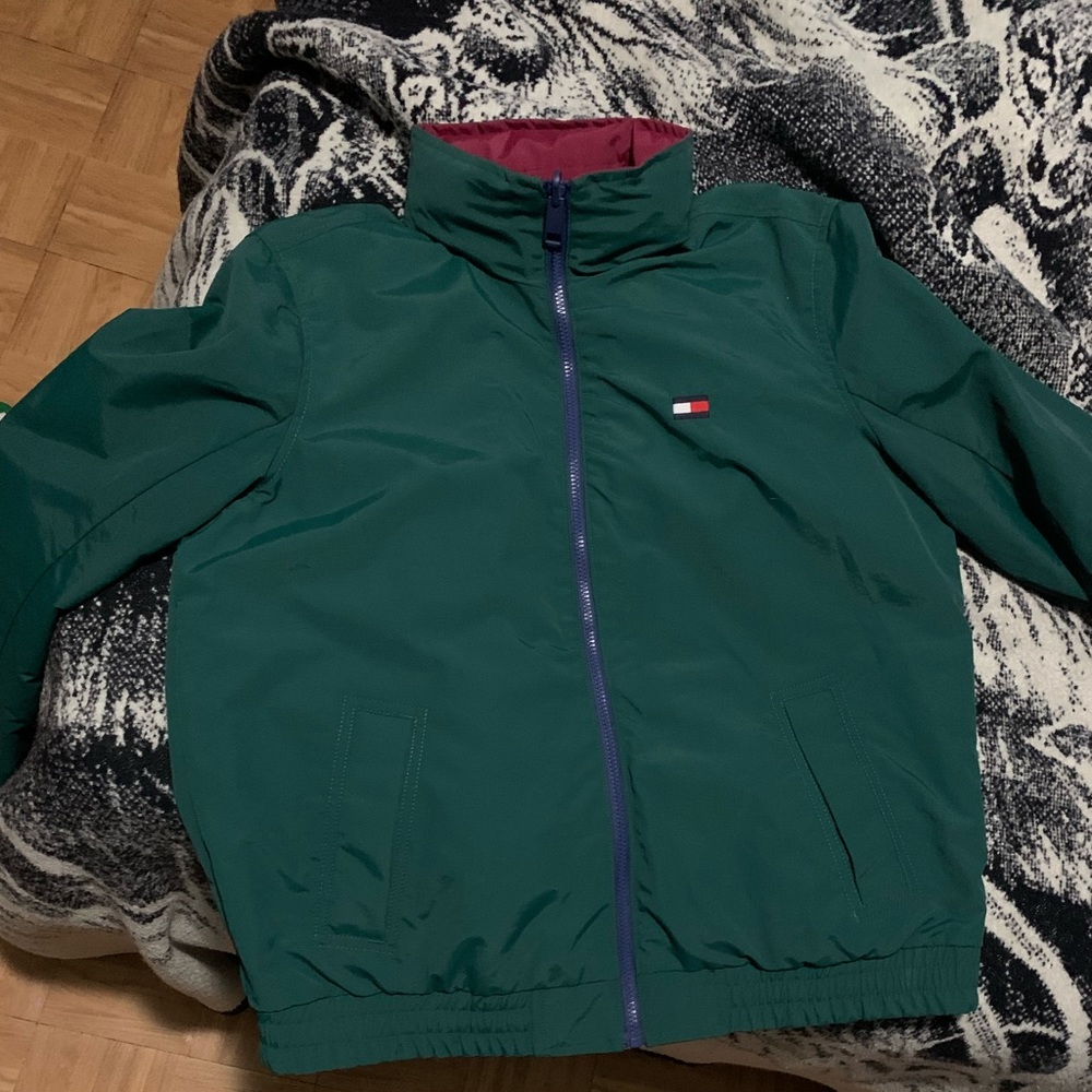 Selling a Green, Burgundy, blue, and white rain jacket from Tommy Hilfiger.